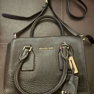 Leather black Michael kors with multiple pockets
